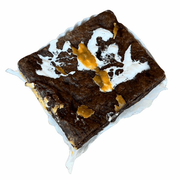 The WPM Original Triple Layer Brownies feature a rectangular brownie with marbled white and caramel swirls, set on a crumpled paper wrapper against a white background.