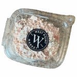 A clear plastic container of ham salad with a West Point Market black and white label on the lid, showing a mixture of finely chopped ham and mayonnaise.