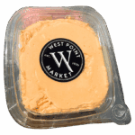 A clear plastic container of orange WPM Cheese Spreads with a black circular West Point Market sticker on top.