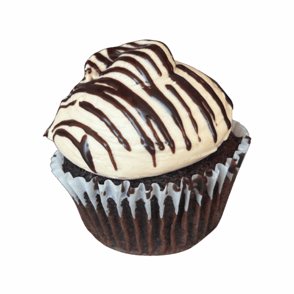 A chocolate cupcake with light brown frosting, drizzled with chocolate sauce, sits in a brown paper liner against a white background.