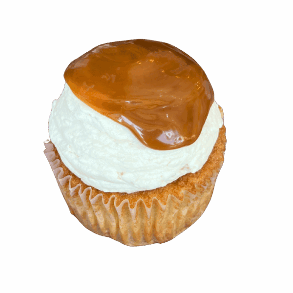 A cupcake with a light-colored cake base, topped with a swirl of white frosting and a glossy caramel glaze partially covering the top, set against a plain white background.